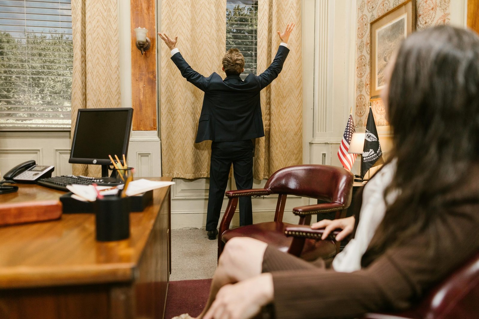 Two professionals in a lawyer's office engaged in a tense negotiation.